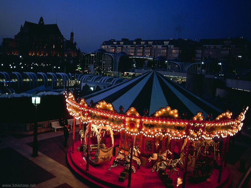 Carousel at dusk in city