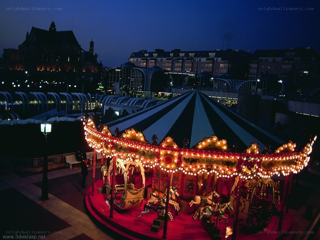 Carousel at dusk in city