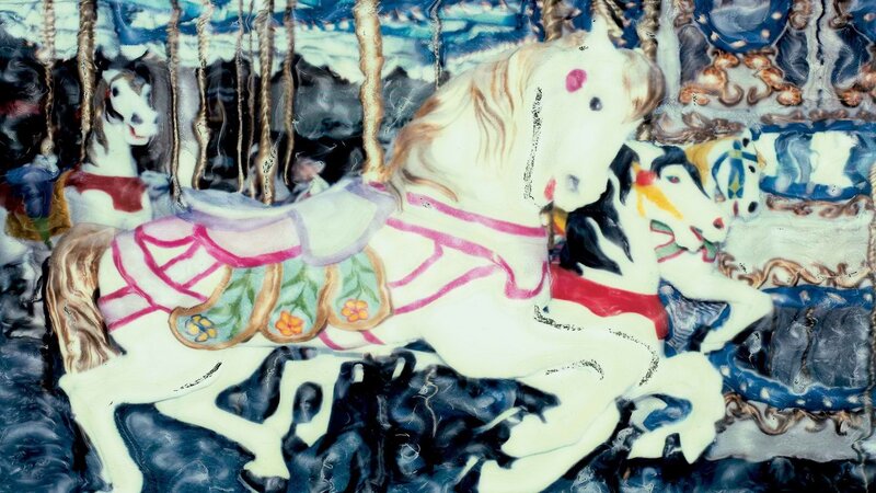Carousel horses in motion
