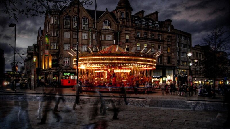 Carousel in City Square — Dark, Dramatic