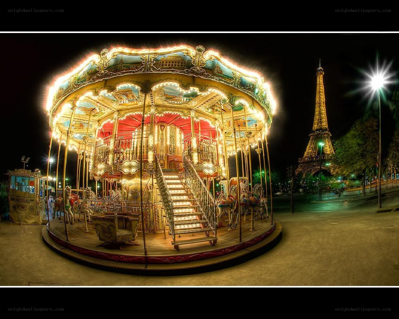 Carousel near Eiffel Tower at night