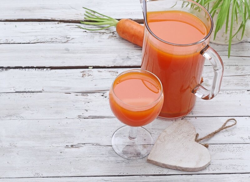 Carrot juice in glass pitcher