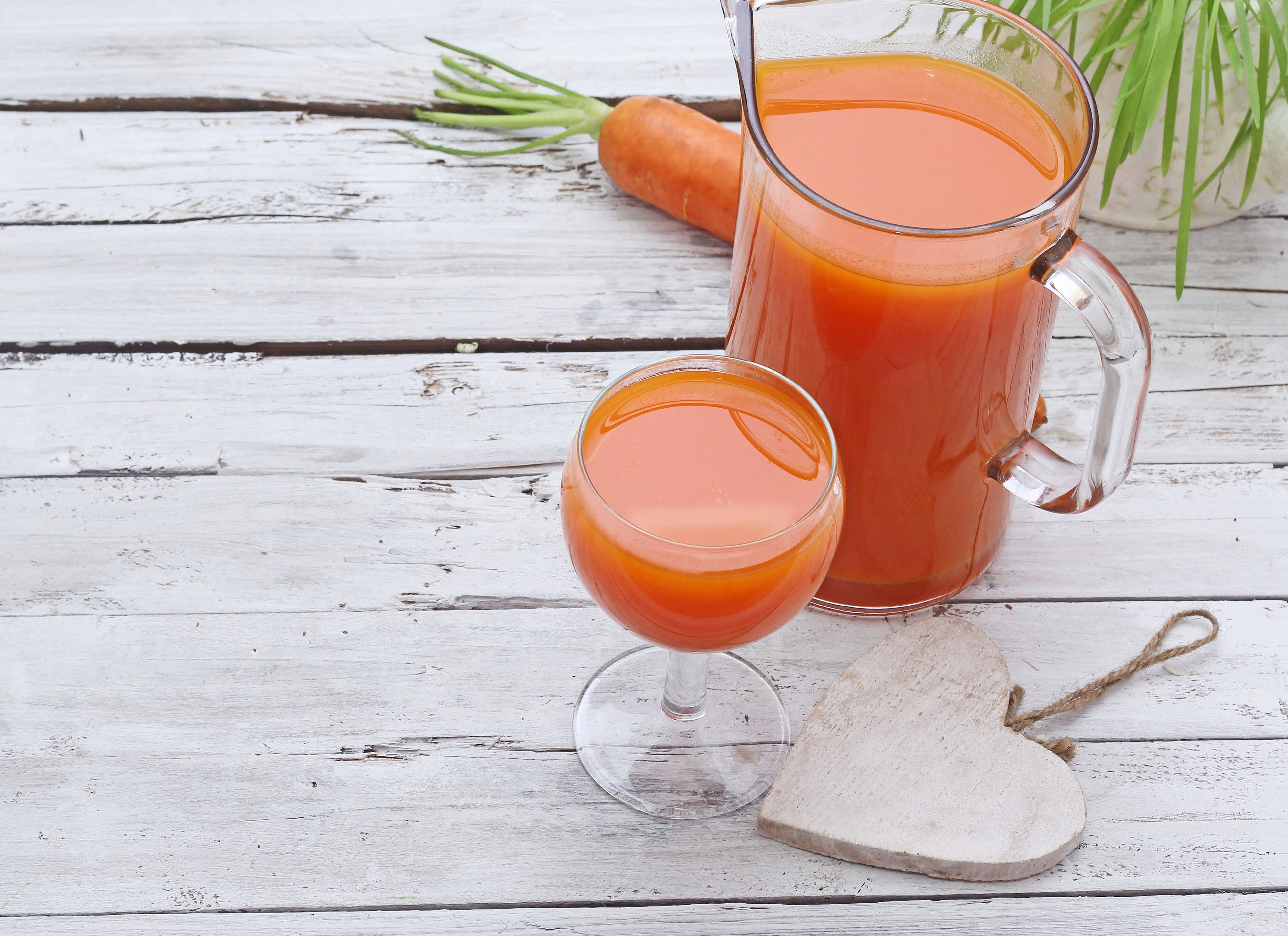 Carrot juice in glass pitcher