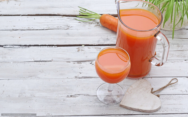 Carrot juice on wooden table