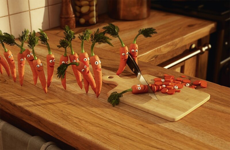 Carrots being chopped on a cutting board