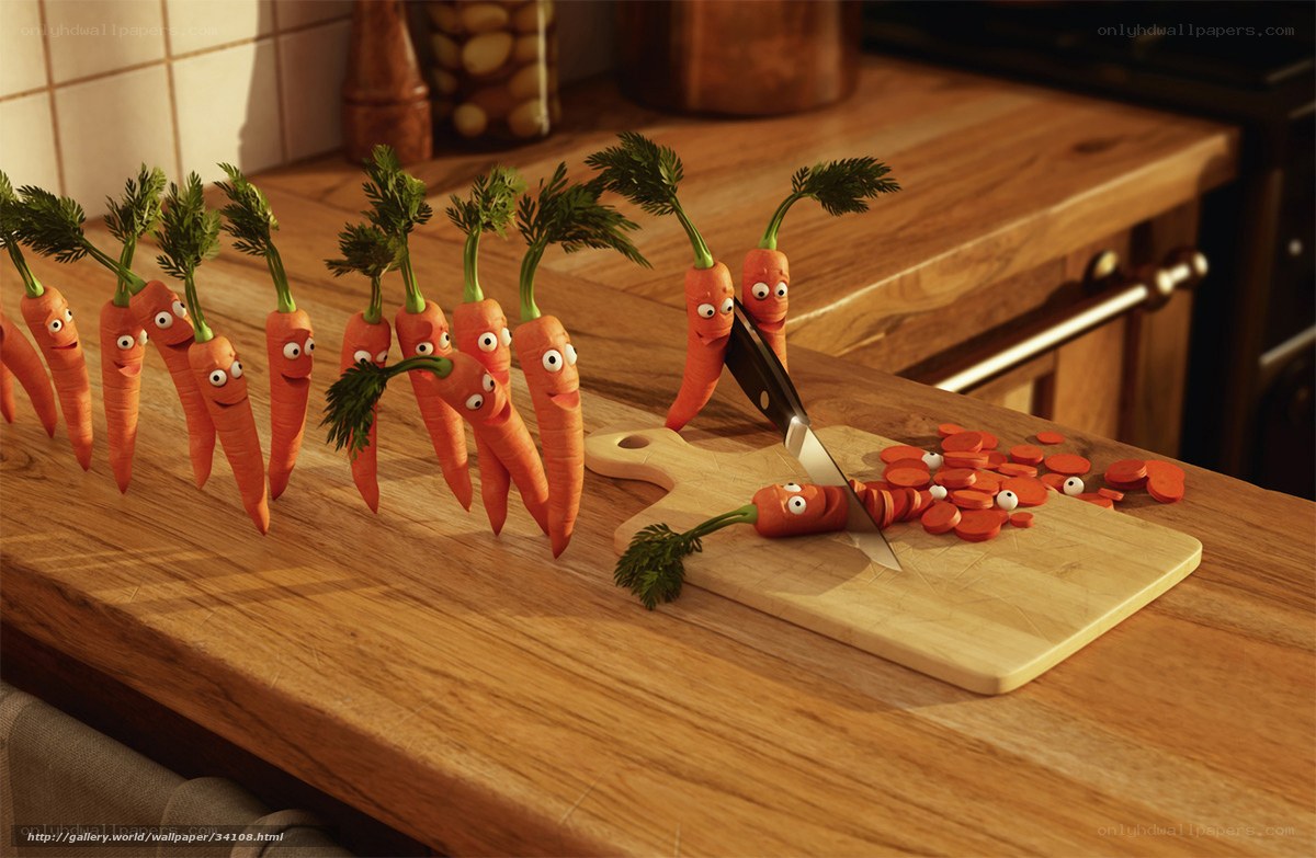 Carrots being chopped on a cutting board