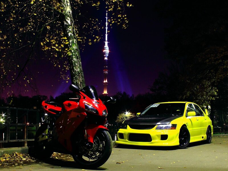 Cars and motorcycle at night