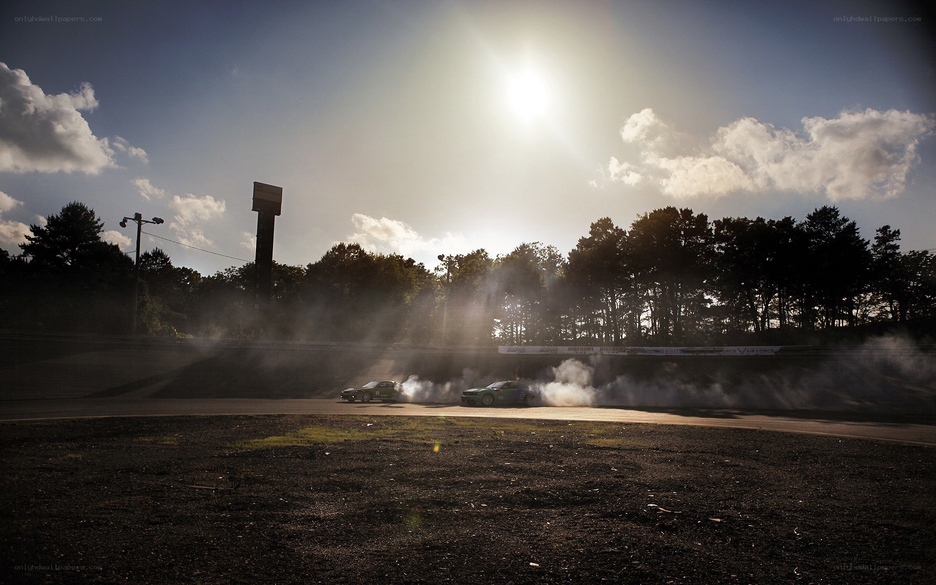 Cars drifting at sunset