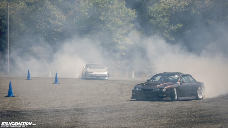 Cars drifting on a track