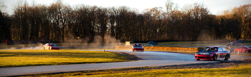 Cars drifting on a track