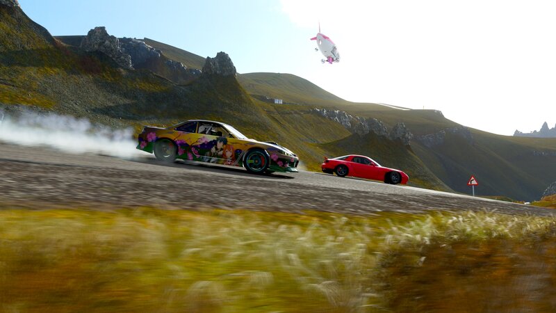 Cars Drifting on Mountain Road