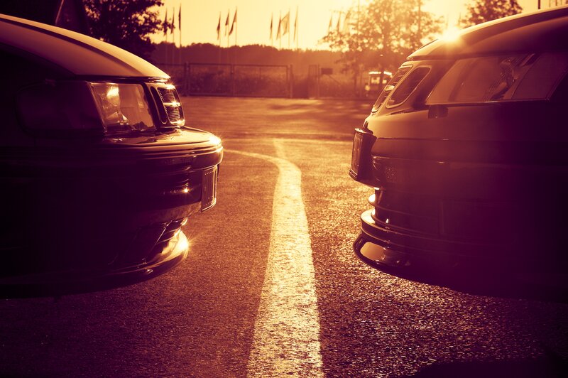 Cars facing each other at sunset
