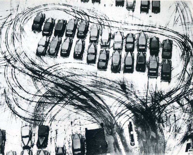 Cars in Snowy Parking Lot