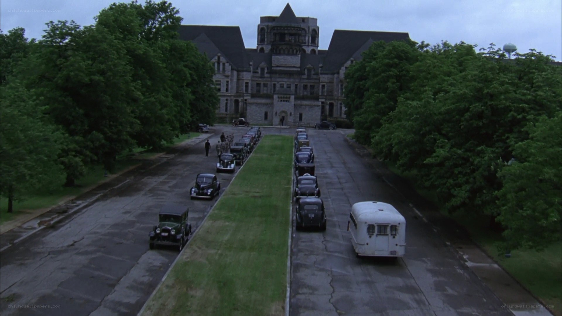 cars lined up at a large building