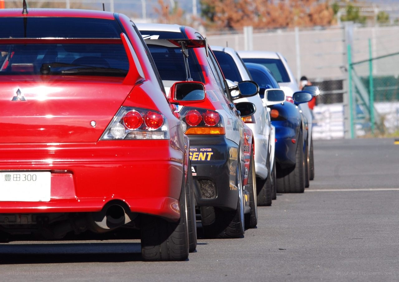 Cars lined up at a racetrack