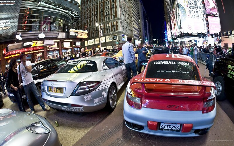 Cars on a city street at night