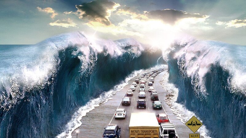 Cars on a road between giant waves