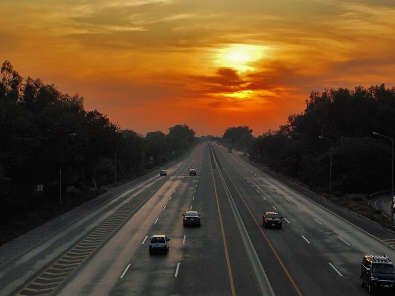 Cars on Highway at Sunset — Orange, Dramatic
