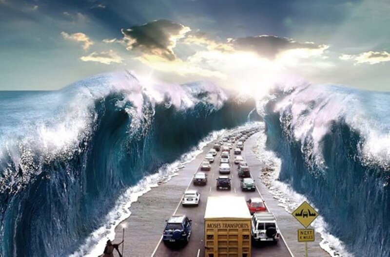 Cars on Road Through Sea