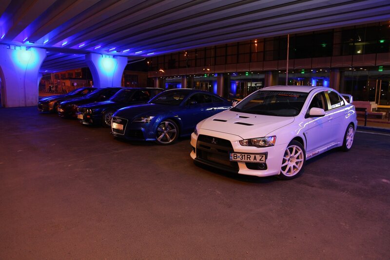 cars parked under a bridge