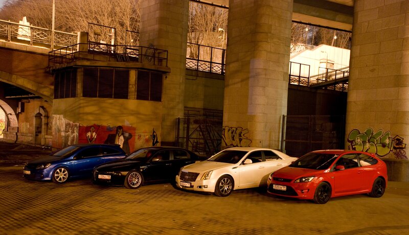 cars parked under a bridge