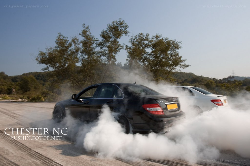 Cars performing burnouts