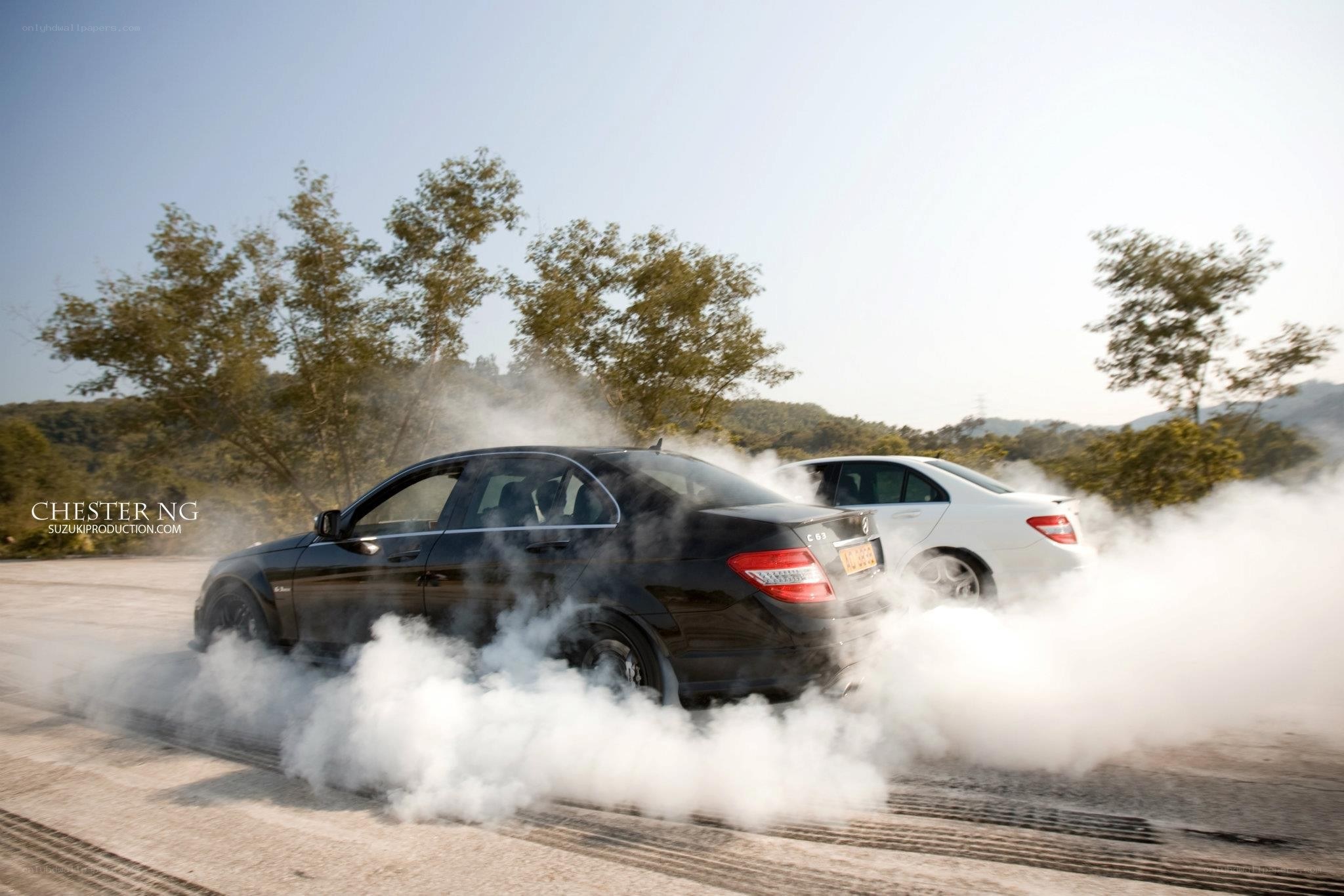 Cars performing burnouts