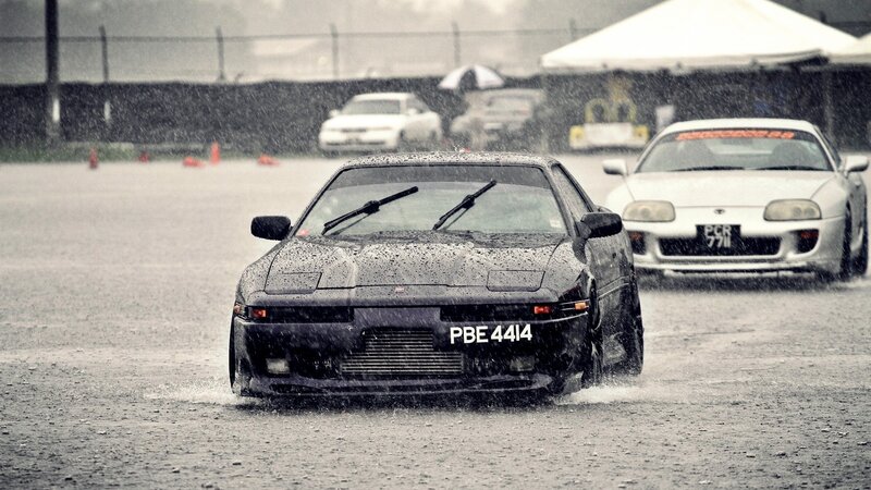 Cars racing in the rain
