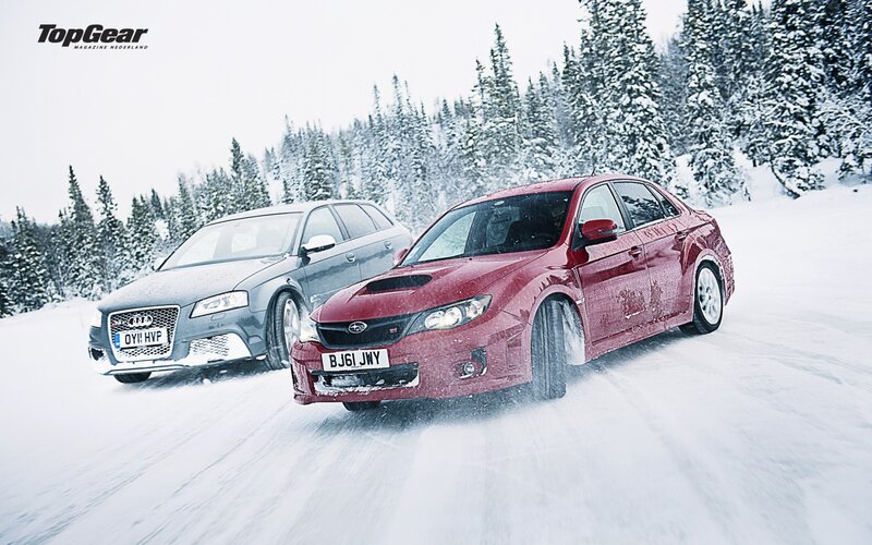 Cars racing in the snow