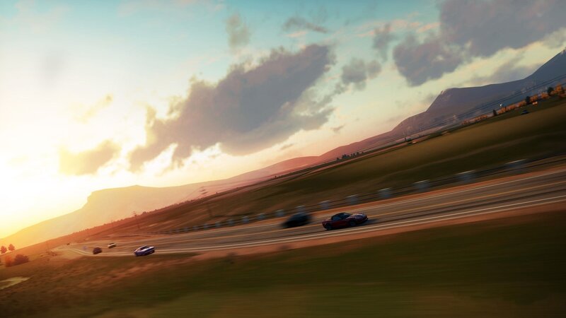 cars racing on a highway