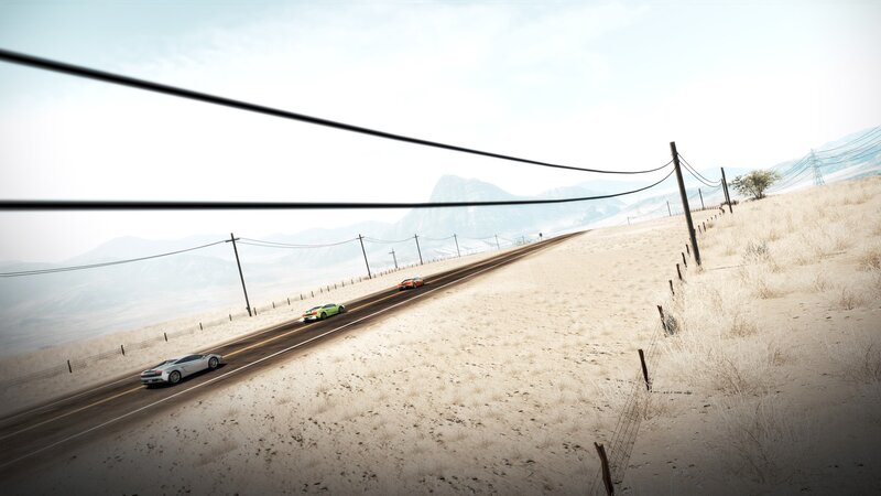 Cars racing on desert highway