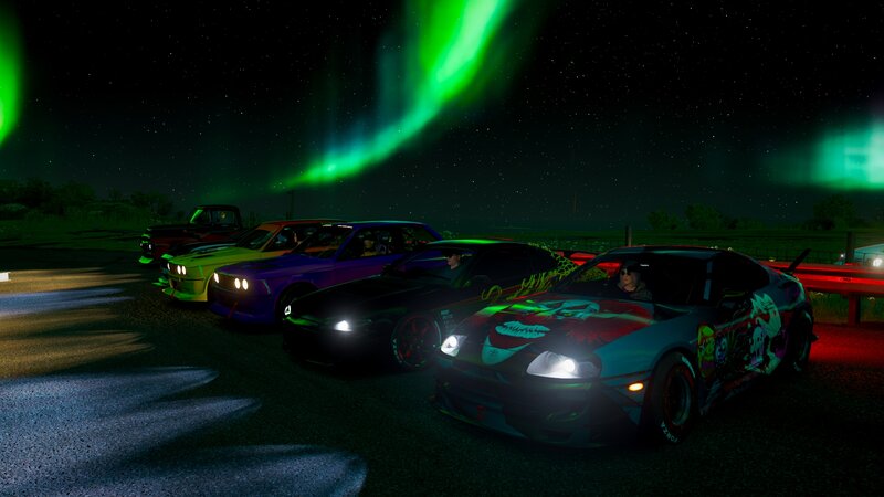 Cars under Aurora Borealis