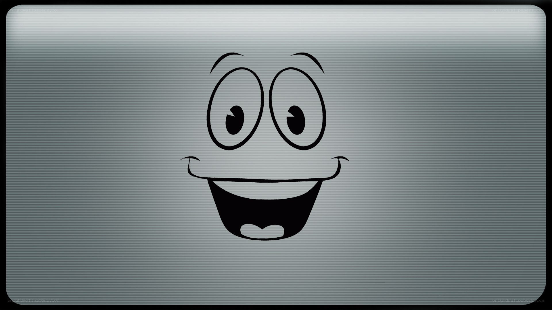 cartoon face on metal surface