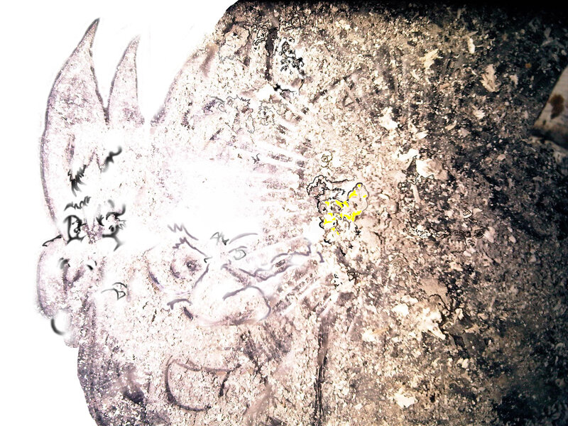 Carved Face on Rock