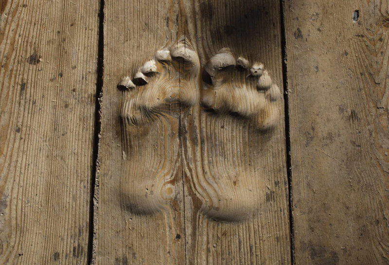 Carved Footprints on Wood