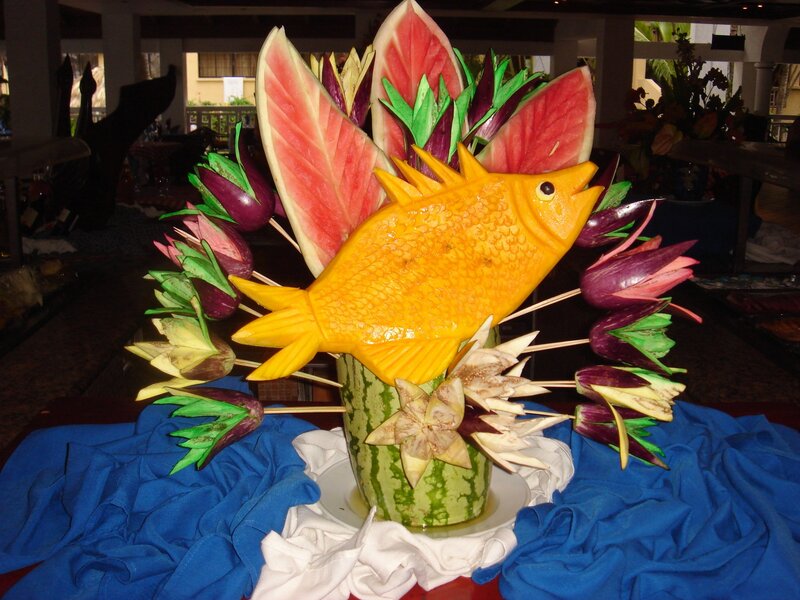 Carved fruit fish sculpture