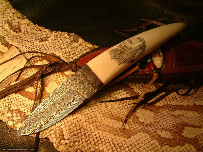 carved knife on snakeskin