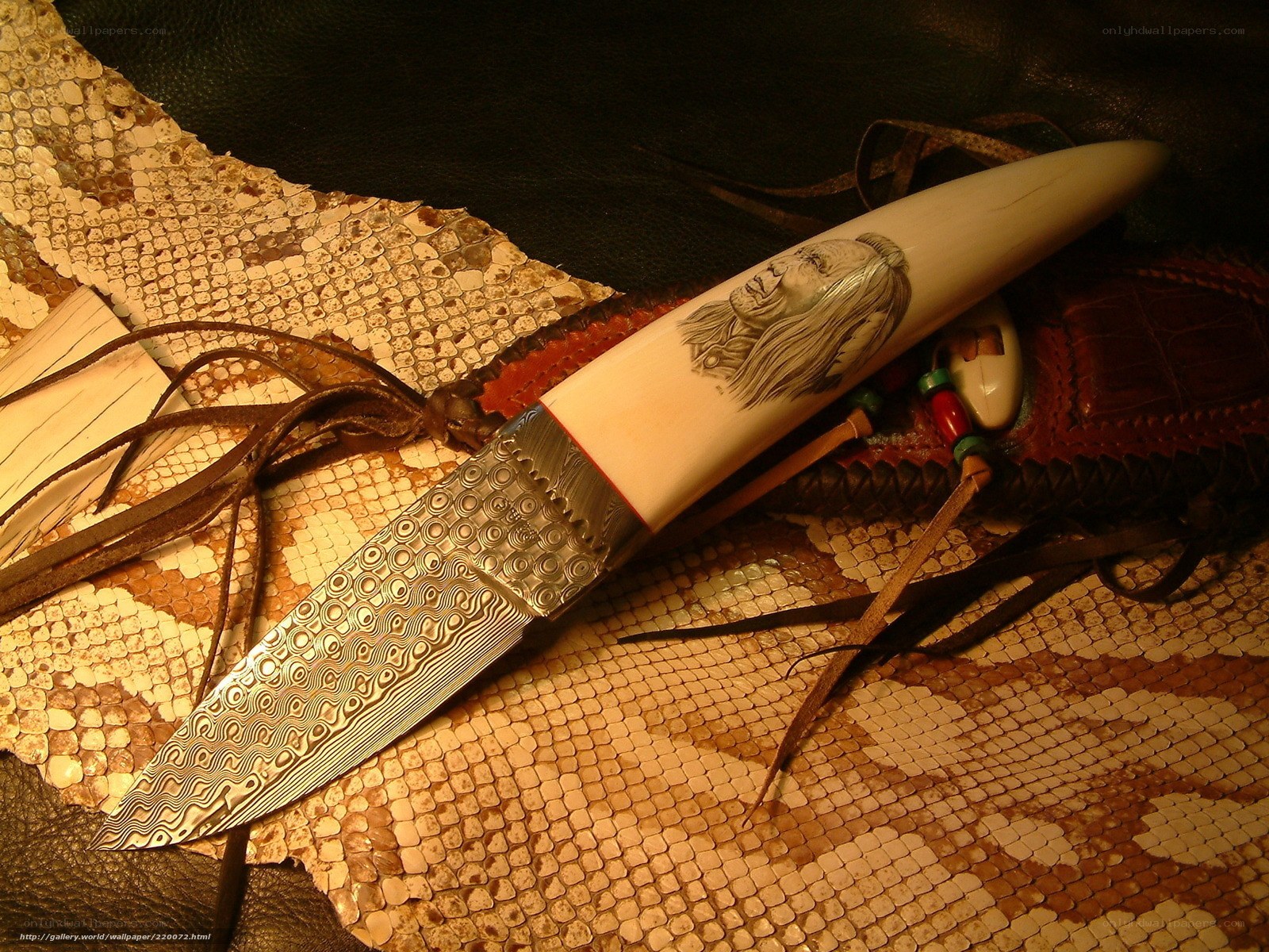 carved knife on snakeskin