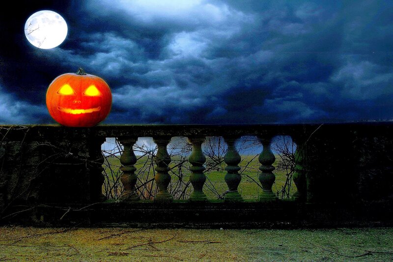 Carved Pumpkin on Railing