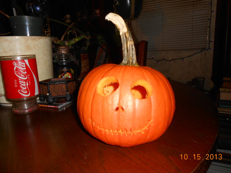 Carved Pumpkin on Table — Orange