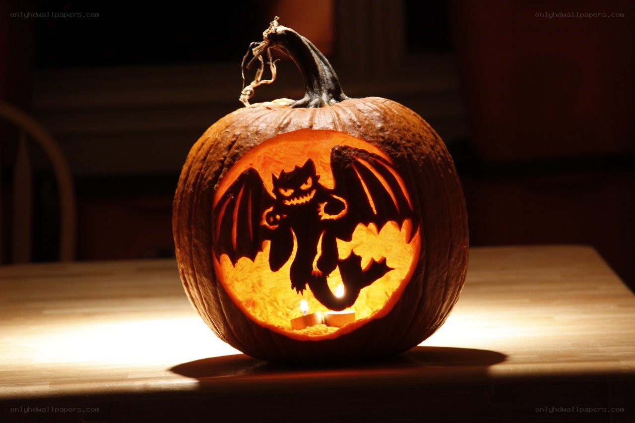 carved pumpkin with bat design