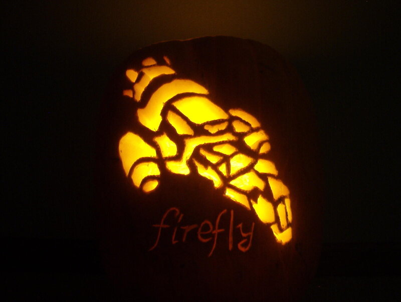 carved pumpkin with firefly design