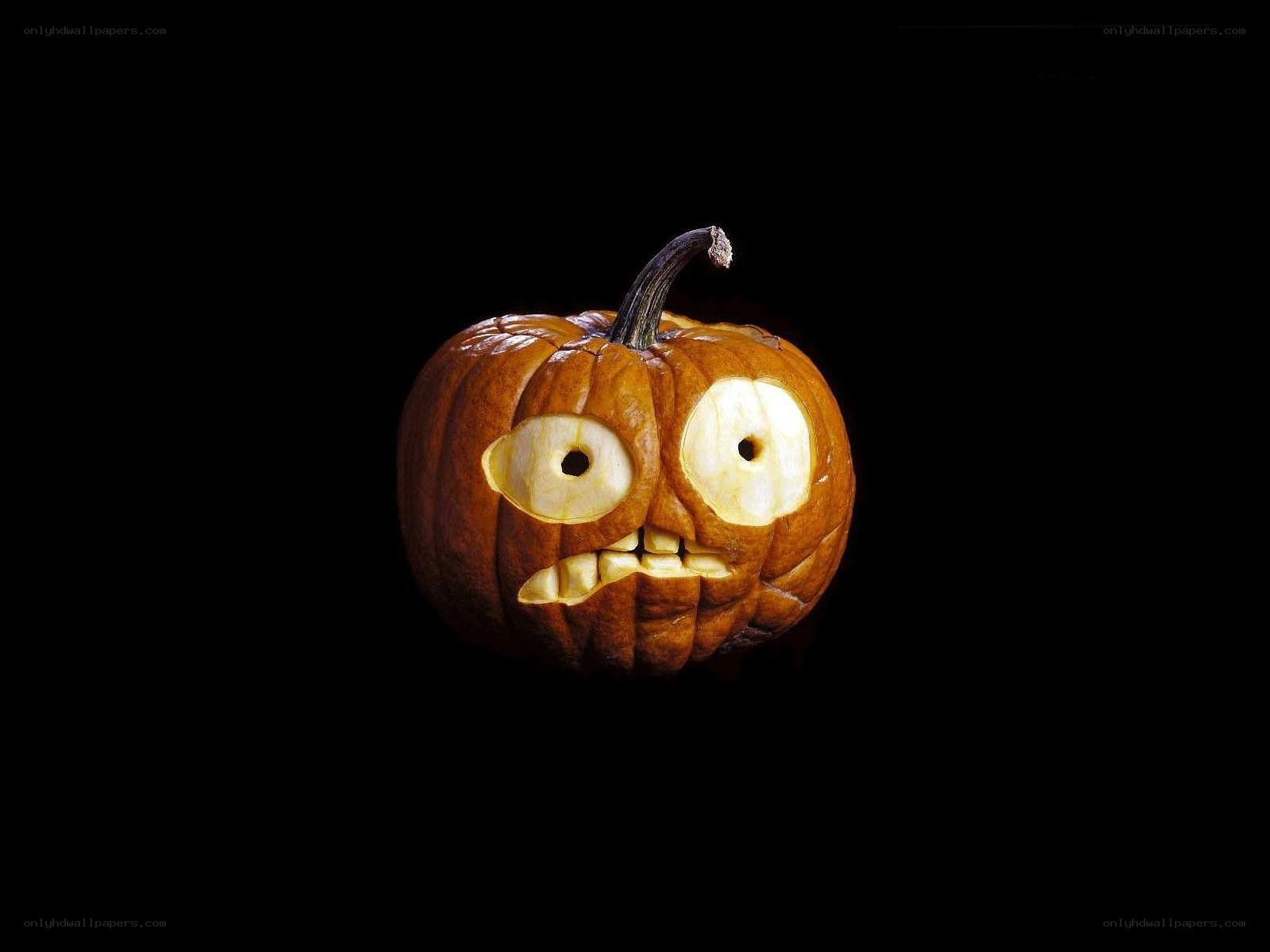 carved pumpkin with glowing face