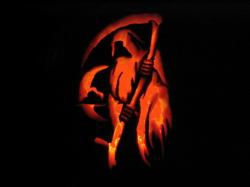 carved pumpkin with grim reaper