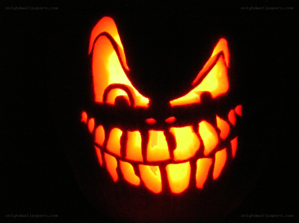 carved pumpkin with scary face