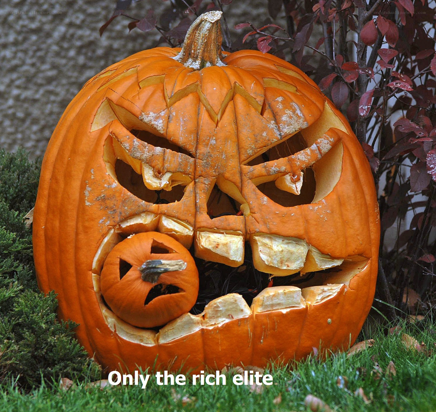 carved pumpkin with smaller pumpkin
