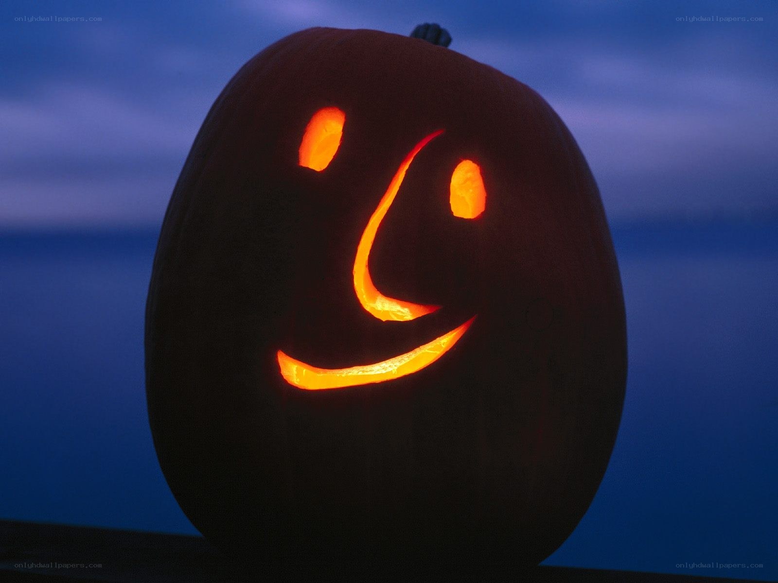 carved pumpkin with smiley face