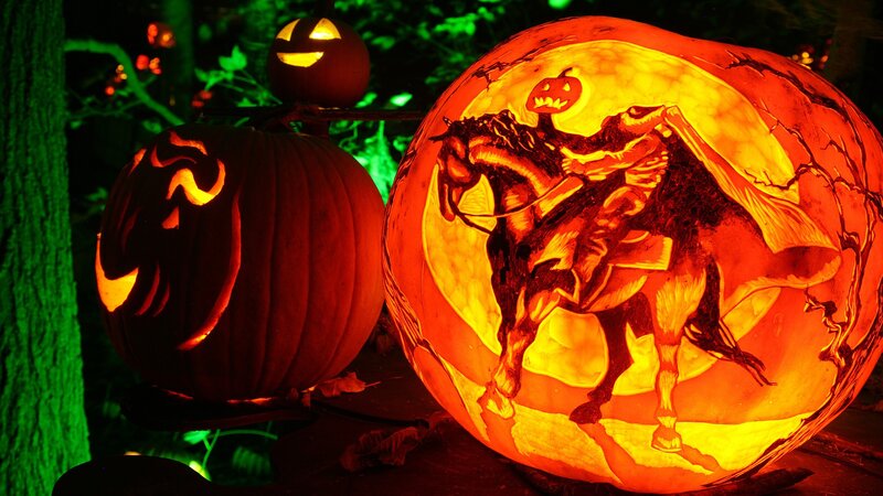Carved pumpkins at night