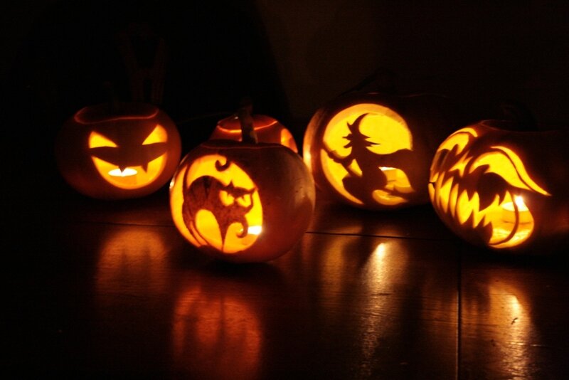 carved pumpkins at night