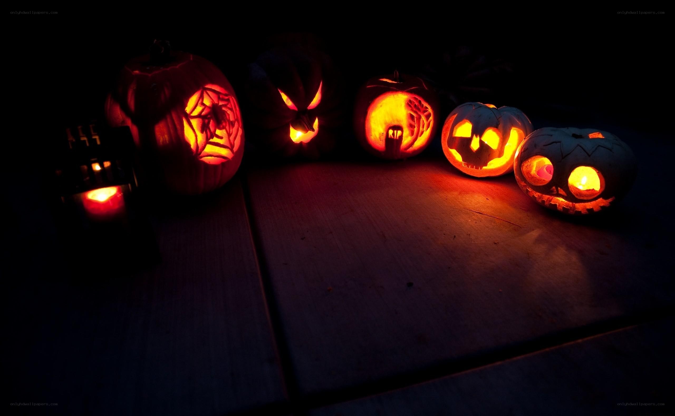 carved pumpkins at night